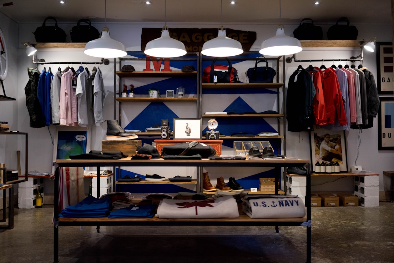 Interior of an independent clothing boutique with clearly branded displays and signage, illustrating how brand clarity now affects Google Ads serving eligibility